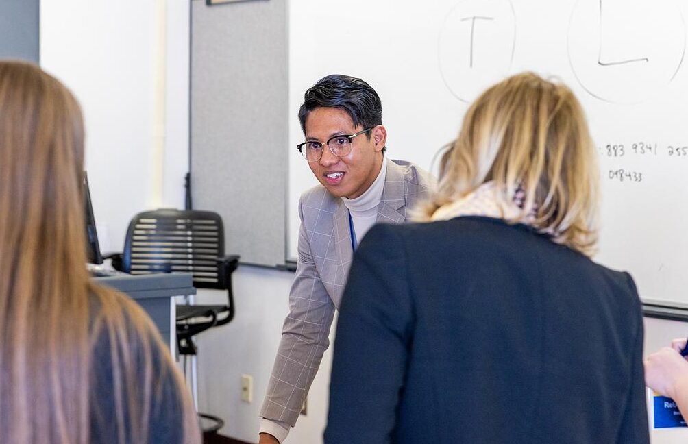 An NAU College of Education speaker talks to interested students.